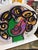 Fantastic original painted luggage box by Peter Keil. This unique piece depicts a colorful face on each side. It was a hat...