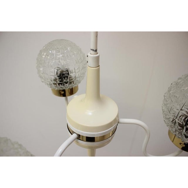 Chandelier by Instala Decin, made in Czecoslovakia, in the 1960's. Made of metal, plastic and glass. Repolished, cleaned,...