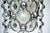 Elegant pair of chandeliers designed by Oscar Torlasco and produced in Italy during the 1970s. Each fixture features a...