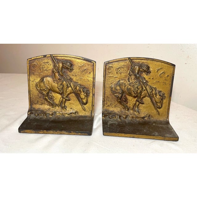 Up for sale is a rare pair of antique early 20th century bronze Native American Indian on horseback bookends. They're done...