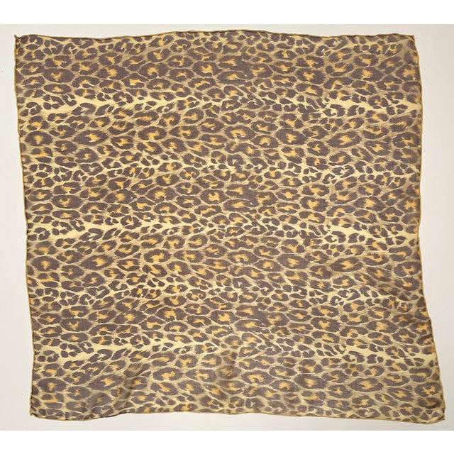 This is a beautiful leopard print scarf with hand-rolled edges.