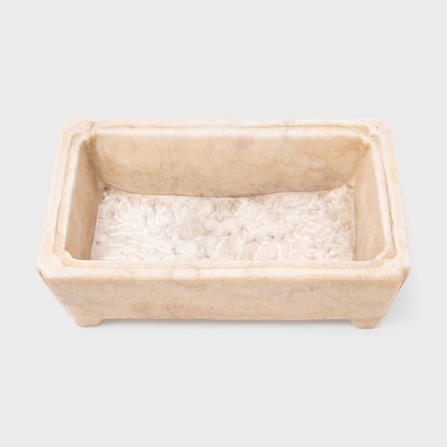This elegant flower basin is hand-carved from white marble to a rectangular form commonly seen with incense burners or...