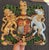 A highly decorative cast metal Royal Coat of Arms plaque, featuring the traditional heraldic arms of the British monarchy...