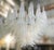 Italian chandelier shown with iridescent opaline Murano glass petals mounted on chrome finish frame / Designed by Fabio...