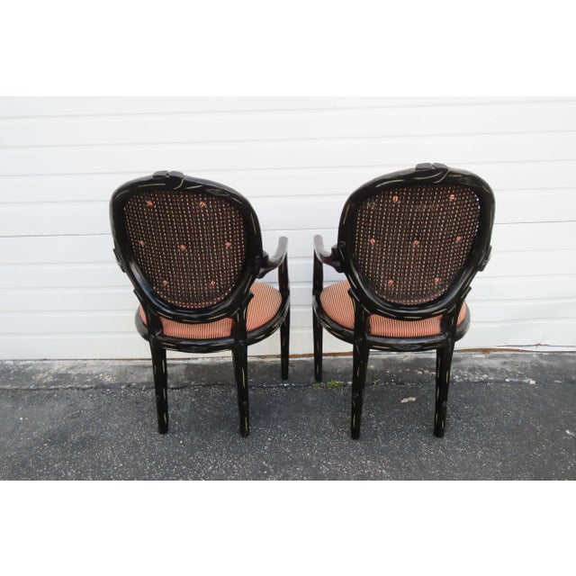 This charming Pair of Chairs is made of wood, caning, fabric, and is in good condition. These two chairs have exquisitely...