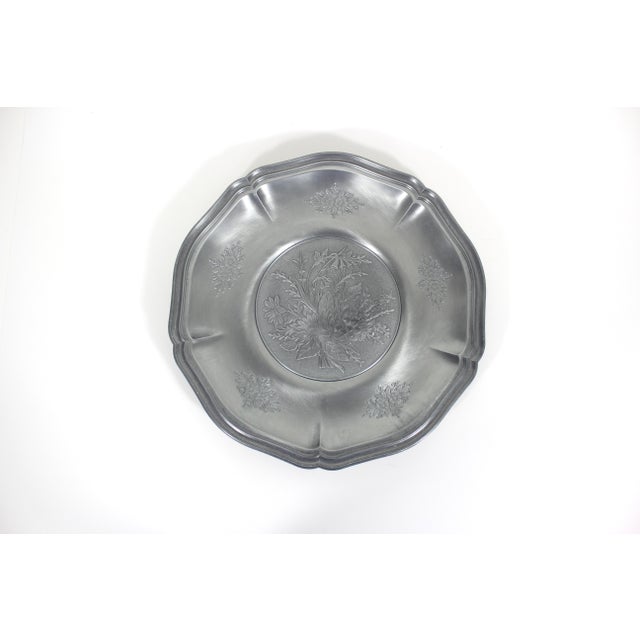 Beautiful German Pewter plate with floral design. Would be perfect on a wall or leaning on a shelf or would make a lovely...