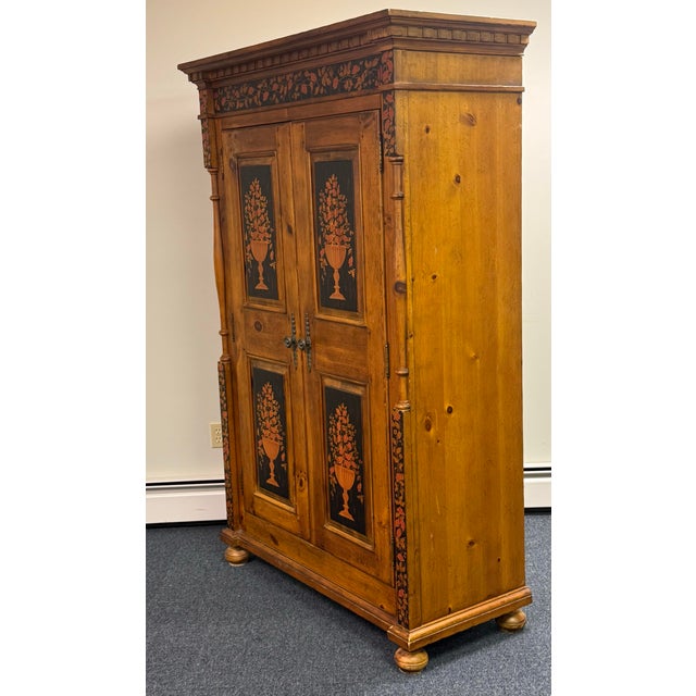 Beautiful vintage Drexel Pinehurst armoire featuring warm, richly grained pine construction with striking hand-painted...
