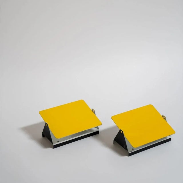 The iconic enameled wall lights by Charlotte Perriand from the 1960’s designed for the apartments of the ski resort Les...