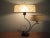 Machine age sculptural metal two shade table lamp. This lamp has a double brass curved sculptural form that holds two bulb...