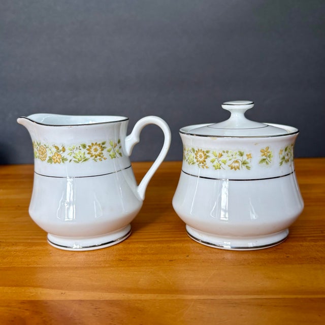 Vintage creamer and sugar bowl set in the Towne House “Spring 3094” pattern. This classic design features a delicate band...