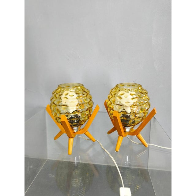 A striking pair of mid-century modern table lamps from 1970s czechoslovakia, showcasing a refined combination of sculpted...
