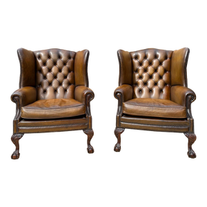 Pair of Leather Wing Back Tufted Chairs on Ball & Claw Feet, English, Ca. 1920.