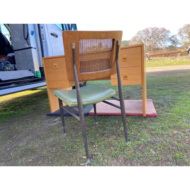 This Vintage Mid-Century Modern Oak Veneer Desk and Cane Chair Set exudes a retro charm with its brown oak finish and teak...