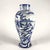 A Taccini family white and blue ceramic vase from Vinci, 1976, featuring a richly decorated lake landscape with boats, all...