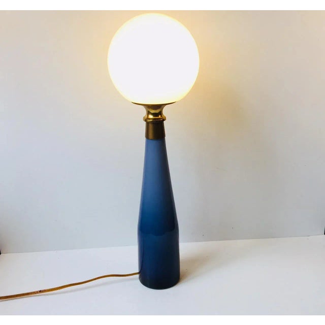 Cased glass Table lamp designed by Bent Nordsted in 1959. It is called nightblue and was manufactured by Kastrup (later...