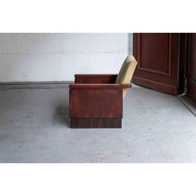 This easy chair was designed and produced in the Netherlands in the 1930’s. The style is reminiscent of the Amsterdamse...