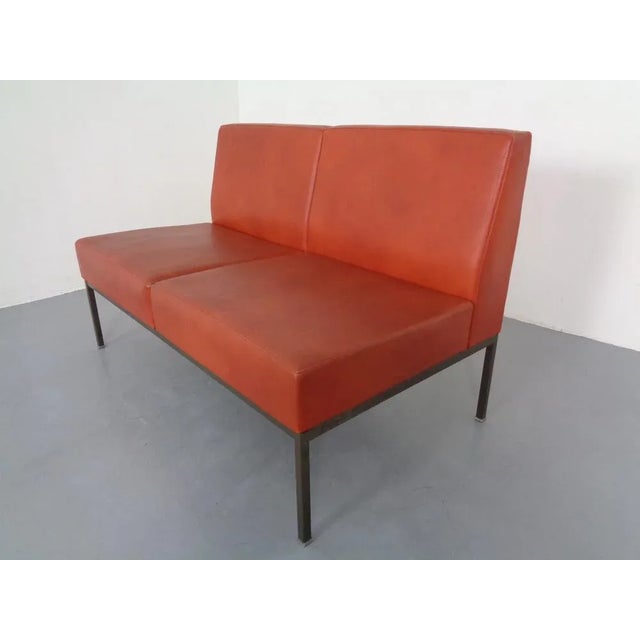 Minimalist 2-seater bench with a square steel tube frame and the original cognac-colored faux leather upholstery. We have...
