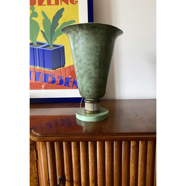 Art Deco Table Lamp France, ca. 1930s Attributed to Edmond Etling Aluminum, brass, glass H 35,5 cm Diam. 25 cm Conditions:...