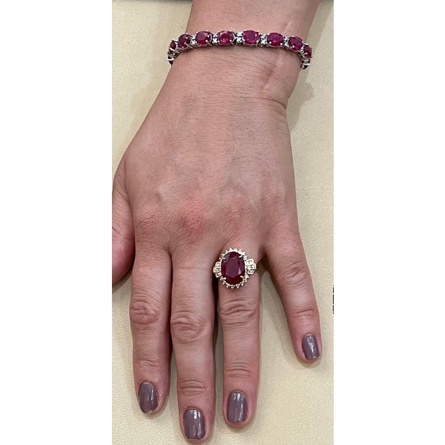 2010s Oval 12 Carat Treated Ruby and 1 Carat Diamond 14 Karat Yellow Gold Ring For Sale - Image 5 of 18