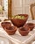 The large bowl is distinguished by its organic asymmetrical form, dramatically rising rim and richly figured teak grain....