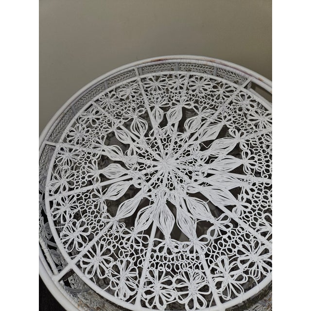 Intricate wire weaving on this Sturdy and Highly Decoratuve Garden stool or drinks table has an inset round glass top...