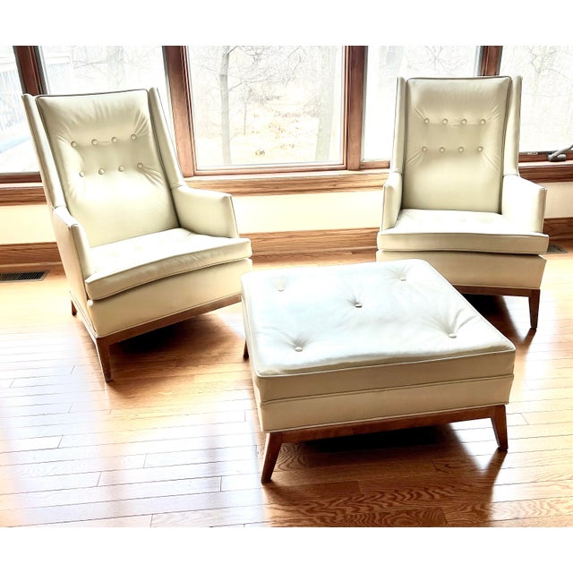 Experience the luxurious comfort and style of these Vintage MCM TH Robsjohn-Gibbings Chairs and Ottoman set. Made with...