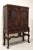 An antique French Gothic style china display cabinet by Rockford Chair & Furniture Co. Walnut with decorative cornice to...
