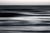 This photograph captures the ethereal essence of ocean waves, rendered in a soft blur that evokes a sense of movement and...