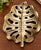 A striking sculptural monstera leaf bowl or decorative tray with a beautifully rich gold finish and substantial 2.6-pound...