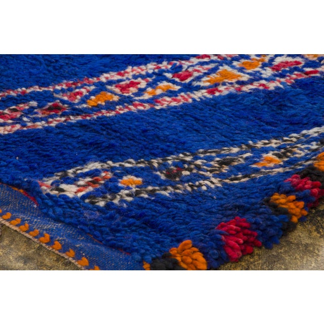 Hand-knotted in wool and originating circa 1950-1959, this 6x10 vintage Moroccan berber rug joins Rug & Kilim’s Moroccan...