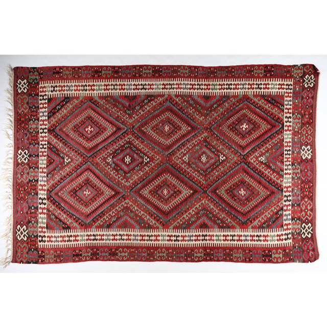 This authentic Fethiye kilim embodies the artistry of Anatolian weaving traditions. Handwoven in wool, it features a...