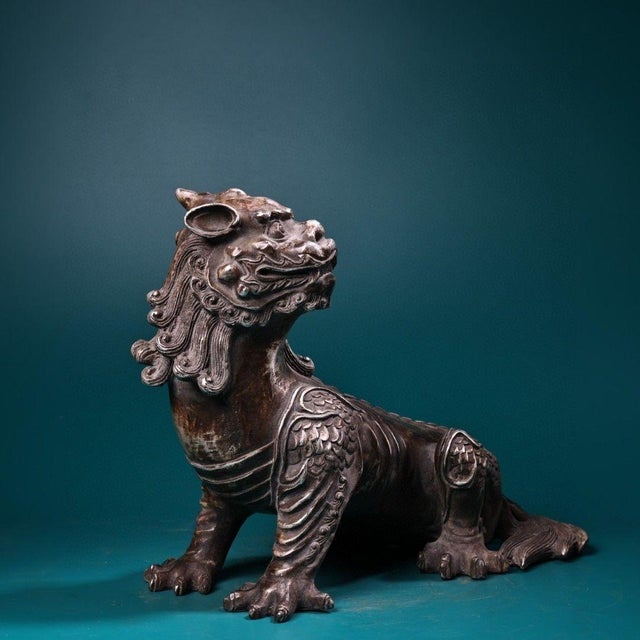 This is a finely cast vintage Chinese bronze figure of a mythical unicorn (a Qilin-like beast), sourced from an old...