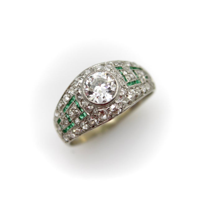 This Art Deco platinum ring is a true beauty from a bygone era. It exhibits some amazing micro pave work with an...
