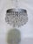 Bring a sleek, retro-modern edge to your home with this stunning vintage mid-century chrome crystal chandelier. Stepping...