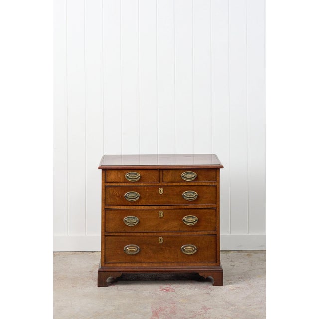 This early Georgian mahogany chest of drawers is built from solid mahogany and utilizes the traditional two-over-three...