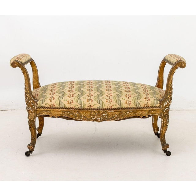 Louis XVI Style Giltwood Window Seat, late 19th century, scroll form cotton upholstered arms and seat above four cabriole...
