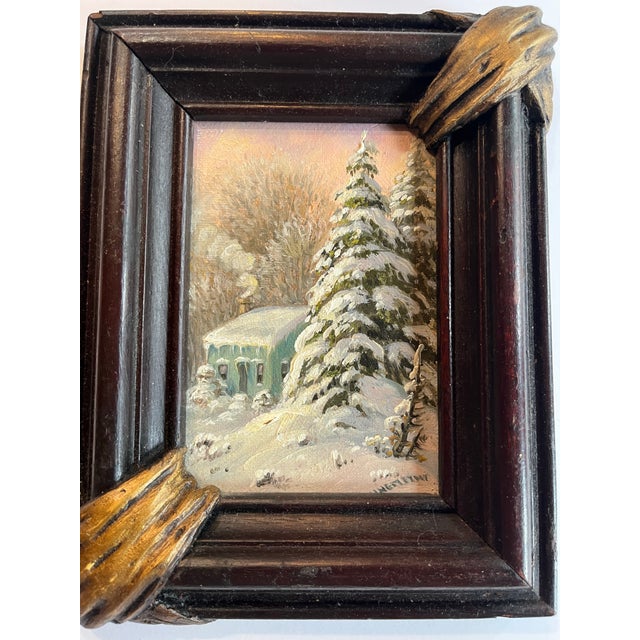 A small oil painting of a snowy landscape with evergreens covered with snow by a country house. Bought from a Woodstock...