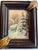 A small oil painting of a snowy landscape with evergreens covered with snow by a country house. Bought from a Woodstock...