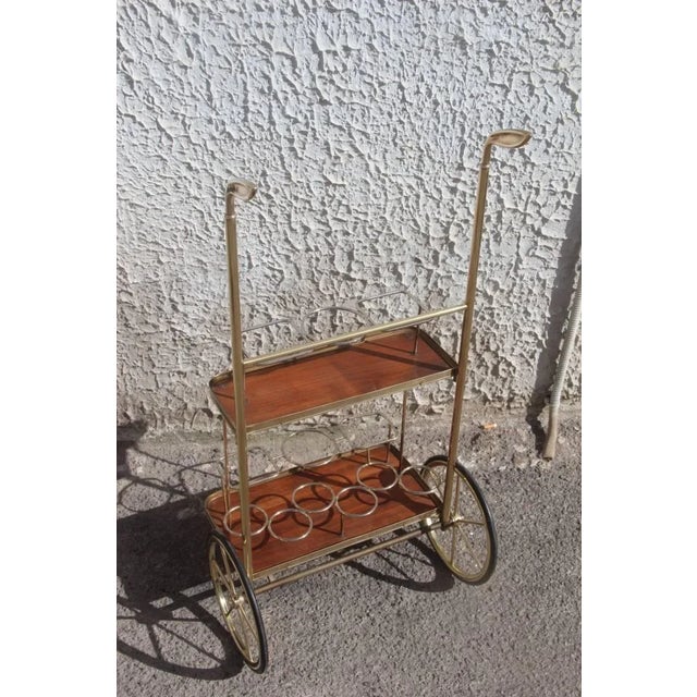This mid-century Italian trolley comes with handles in the shape of golf clubs.