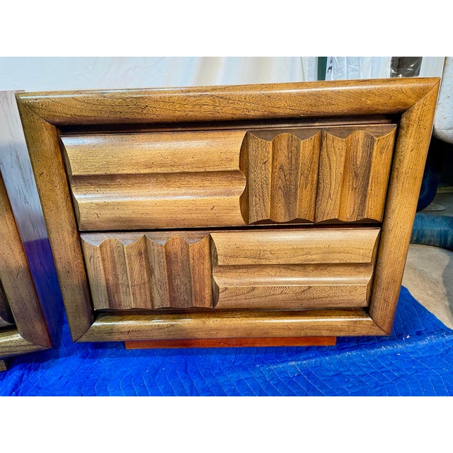 This pair of mid-century modern Brutalist nightstands is a bold statement piece for any bedroom. Crafted with the high-...