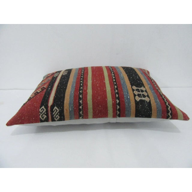 Handmade decorative pillow cover made from a vintage Turkish kilim rug. Backed with good quality cotton fabric. Pillow...