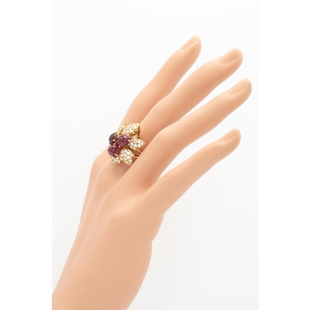 This stunning French cocktail ring exquisitely crafted in 18 karat yellow gold, designed as a dimensional flower in full...