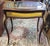 Antique French Louis XV style ormolu-mounted bijouterie display table. Features gilt bronze ormolu mounts and feet,...