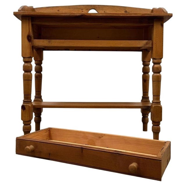 A charming vintage 20th-century english washstand, well crafted from pine and distinguished by its traditional form,...