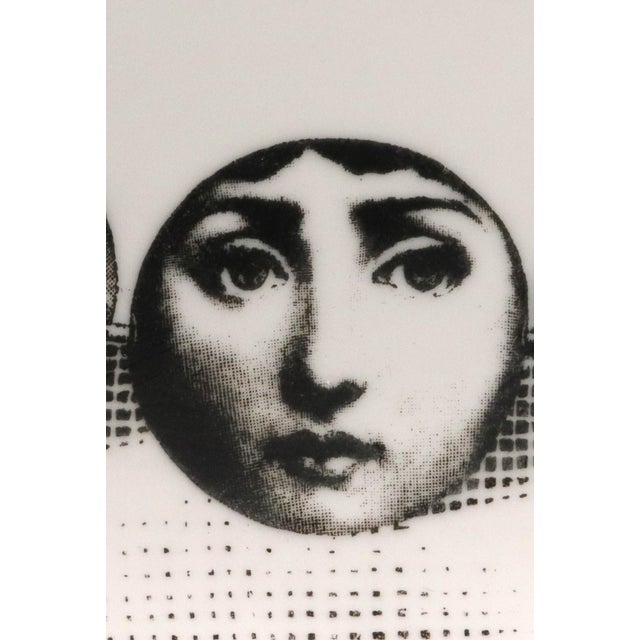 "Adorned in Self": Fornasetti "Themes & Variations" Plate #107 (Necklace of Faces) 1960s-Early 70s. A surreal and visually...