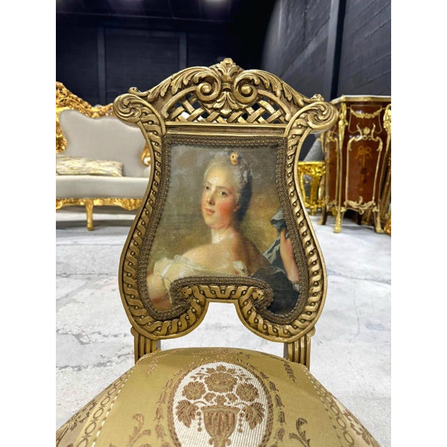 Elevate your home décor with this exquisite French Rococo accent chair. Fully refinished with radiant gold leaf, it...