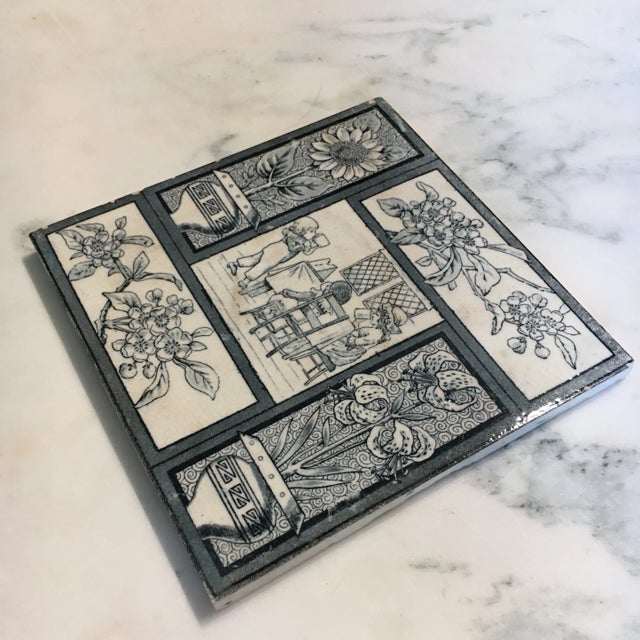 This English Victorian Aesthetic Movement tile features a tea party and floral, geometric border. The series of this tile...
