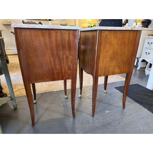 This is a pair of 19th Century French antique side tables. They are art nouveau style. They are burled walnut with satin...