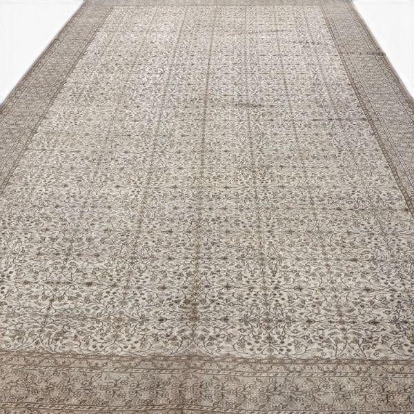 This antique Sivas Turkish rug, more than 100 years old, is distinguished by its soft, neutral palette and elegant allover...