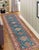 Enhance your home with this exquisite hand-knotted Kazak rug, crafted from fine hand-spun wool and dyed with all-natural...